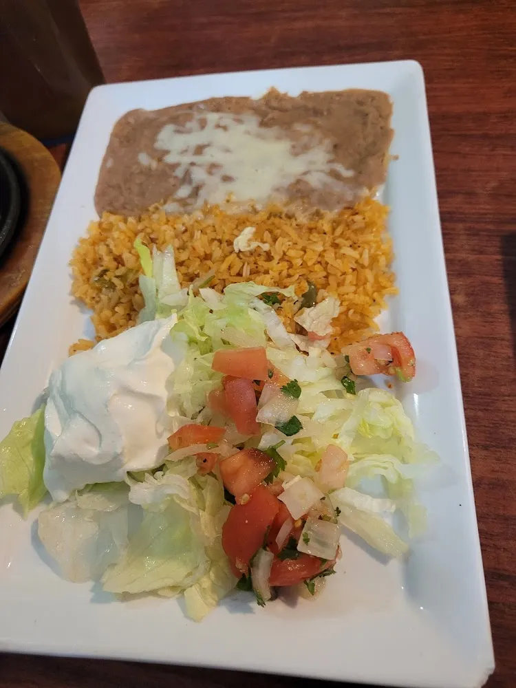 Fajita Toppings Refried Beans Sour Cream and Ensalada
